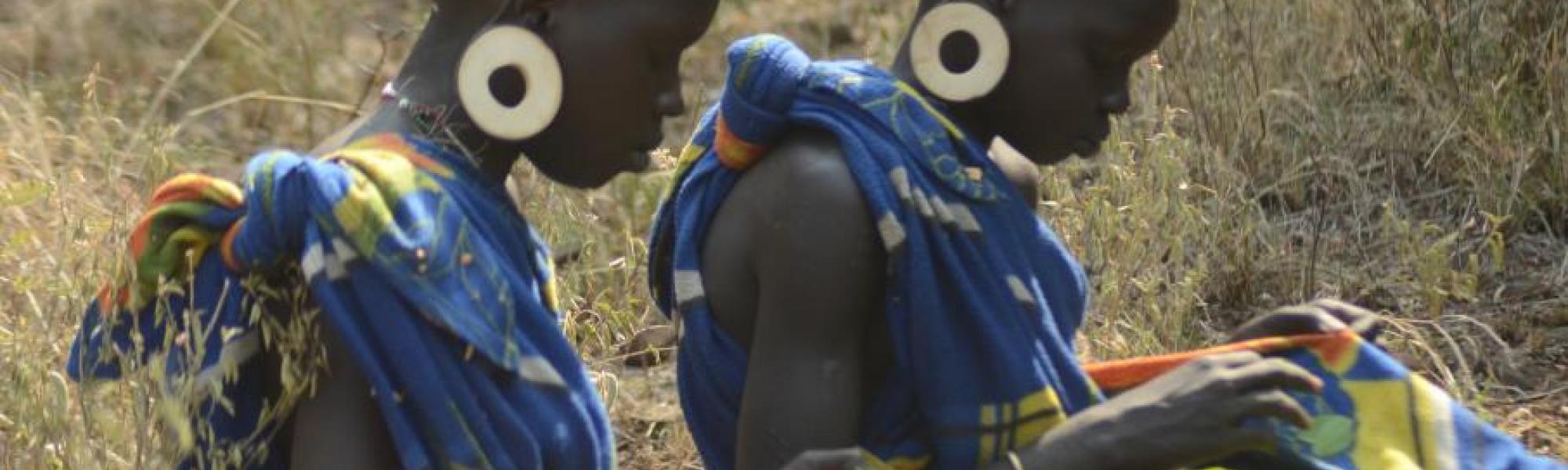 Girls gathering wild edible leaves called kinnoi